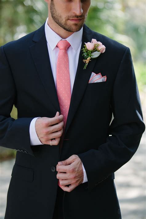 navy suit and pink tie